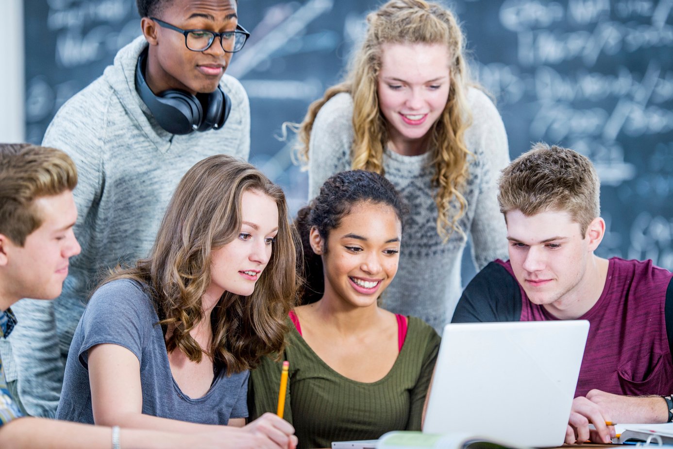 Teens Working On A Project